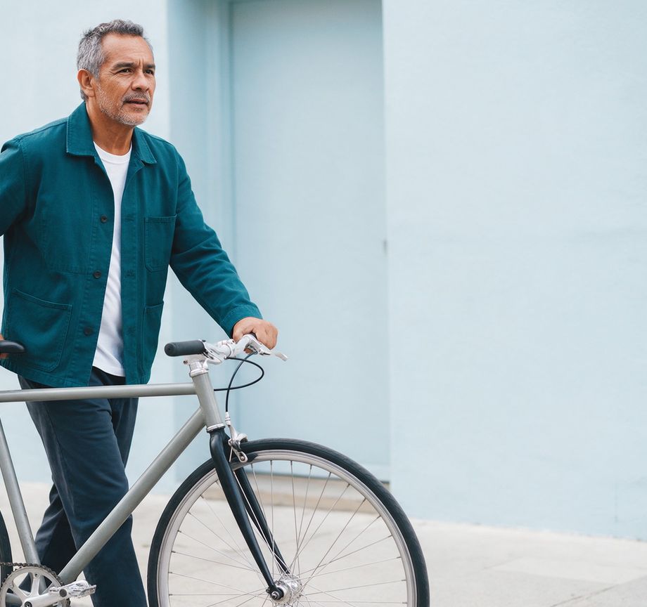 A man walking a bicycle
